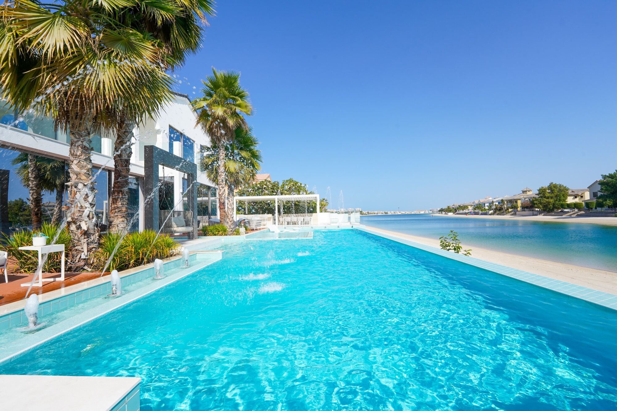 Infinity Pool, Private Beach, Staff on Arrival, PALM JUMEIRAH · DUBAI — by LX and AMG Luxe